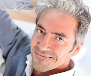 stock image of a man smiling for a blog about cosmetic injectables for men in Princeton, NJ