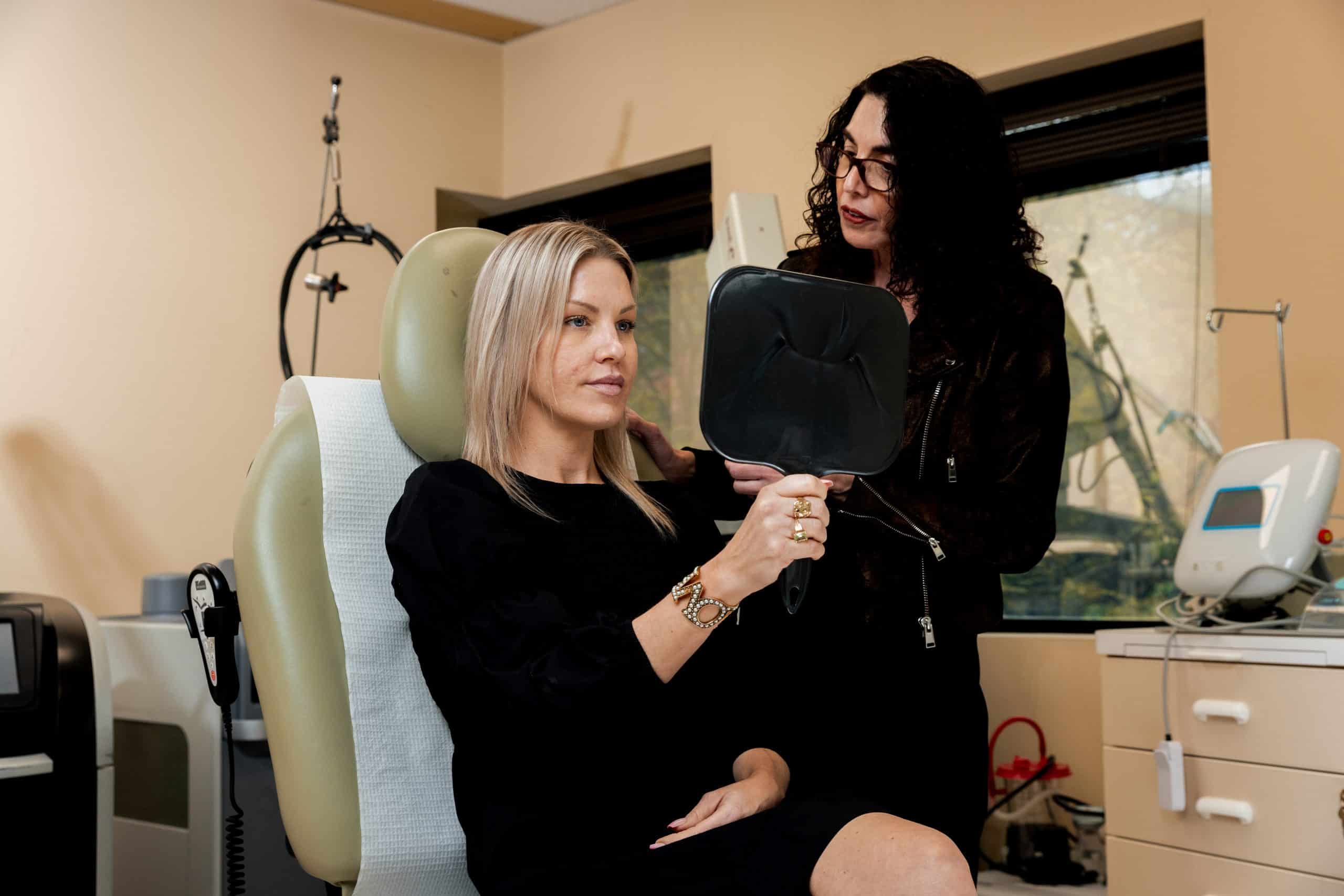 eugenie-brunner-md-princeton-nj-ellacor-consultation-2 Dr. Brunner consulting with a patient about non-surgical treatments to reduce submental fat in Princeton