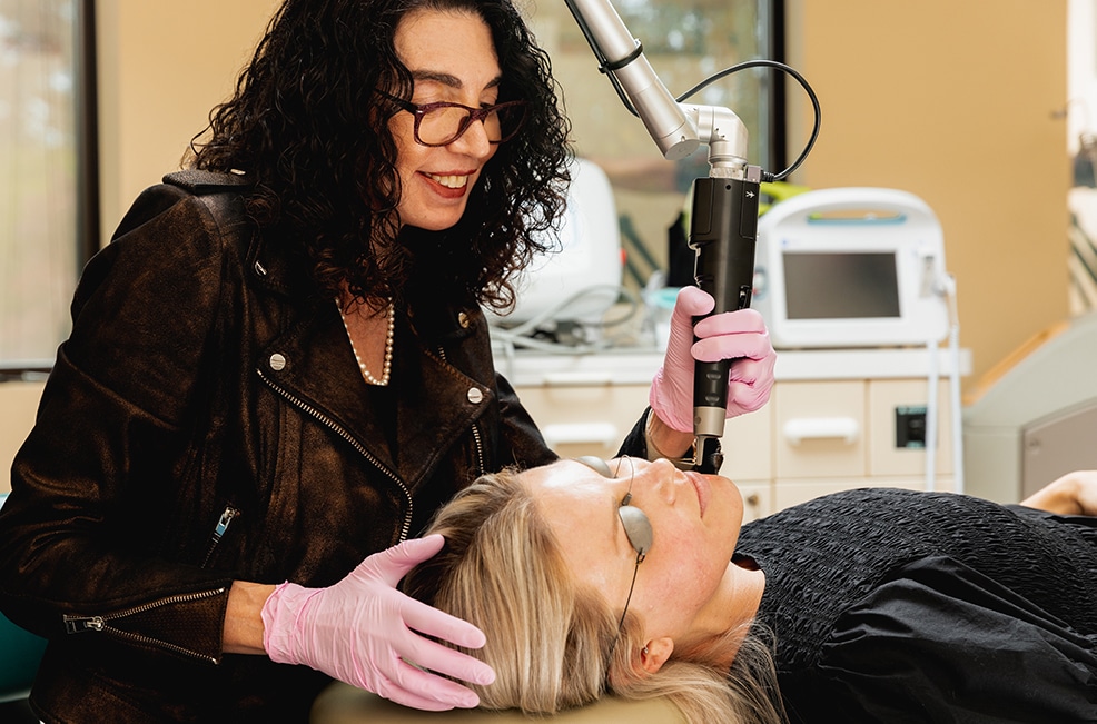 eugenie-brunner-md-facial-plastic-surgery-picosure-tri-zone-laser-lift Dr. Brunner with a patient who is undergoing a Tri-Zone Laser Lift in Princeton