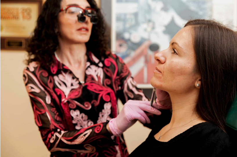 brunner-with-cosmetic-patient doctor examining patient before treatment
