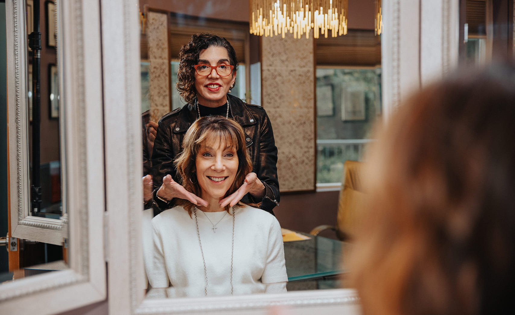 Dr. Brunner with female patient looking at the results in the mirror